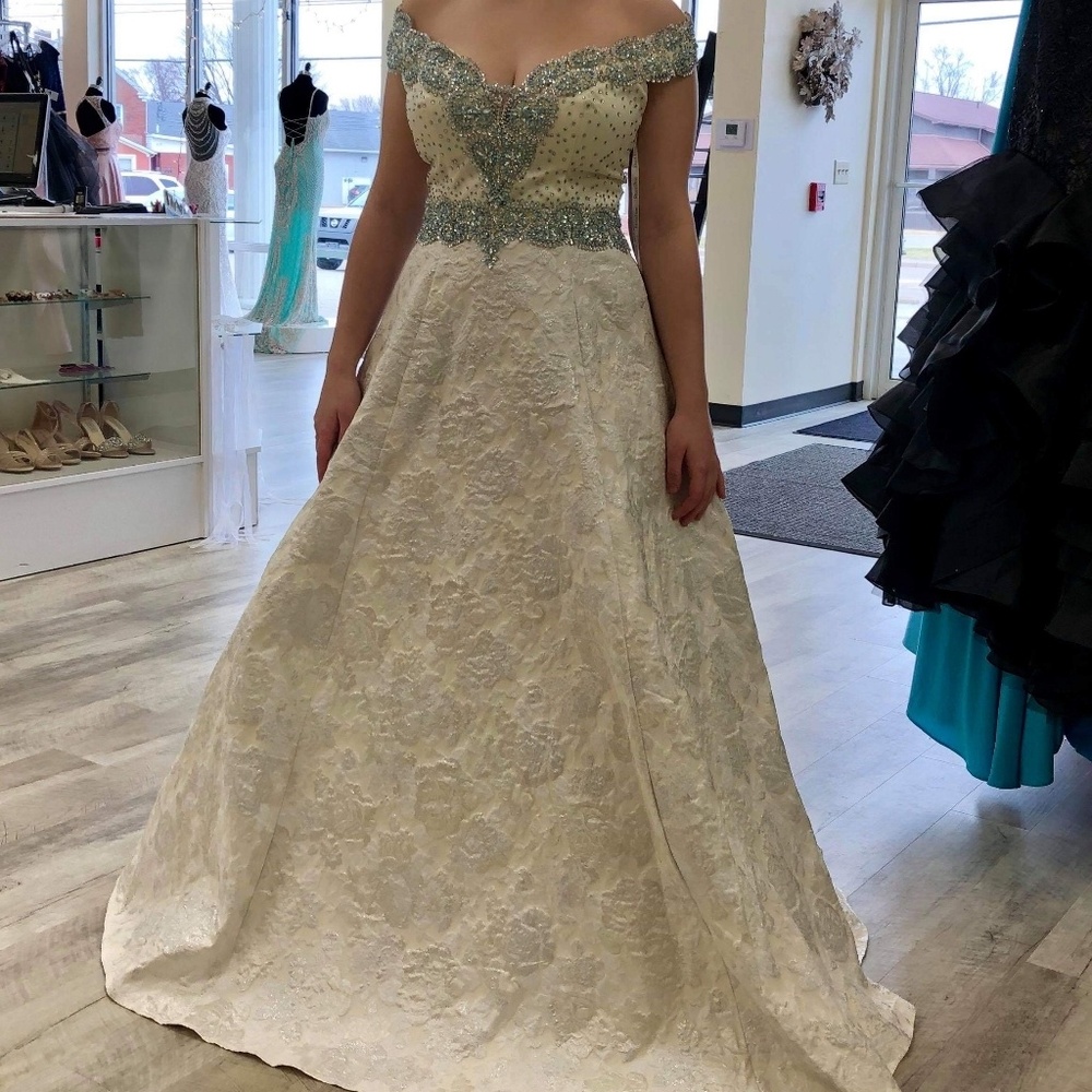 White gown with blue jewels